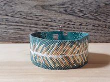 Load image into Gallery viewer, Beaded Cuff - Feather on dark turquoise
